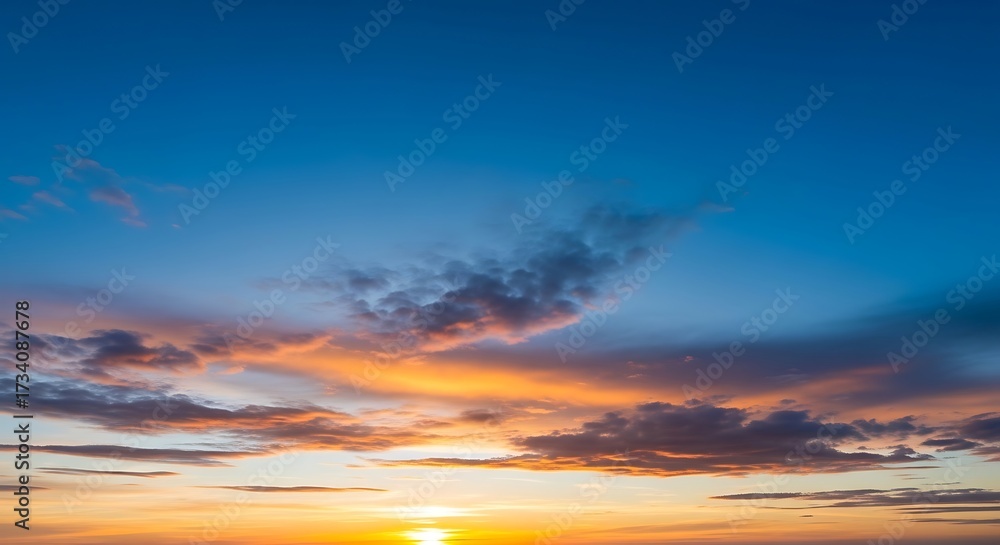 Fototapeta premium Vibrant Sunset Sky with Clouds and Golden Light.