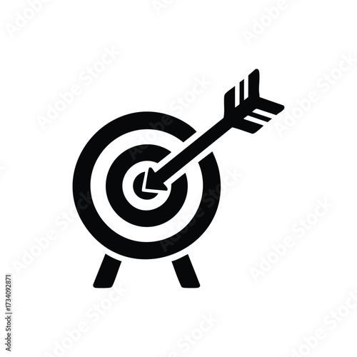 Close-up of a dart hitting the bullseye on a board representing precision and goal achievement