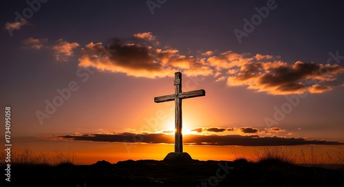 Wooden Cross on a Hill During a Golden Sunset.