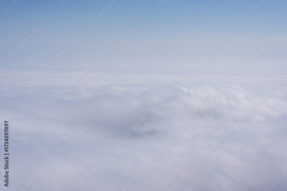 Naklejka premium Above the clouds view with soft atmospheric layers and tranquil sky 