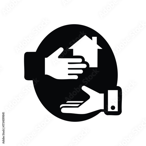 Hands exchanging a house model symbolizing real estate transaction or property transfer in a conceptual setting