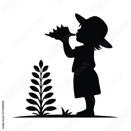Silhouette of a young child wearing a hat blowing into a seashell by a leafy plant silhouette