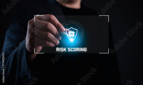 AI security risk scoring concept. Businessman holding digital shield icon with AI chip, showing artificial intelligence in risk evaluation, cybersecurity, and smart decision-making in modern systems.