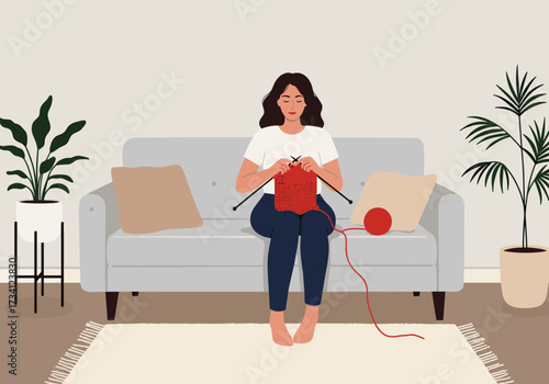 Knitting a cozy red scarf at home indoor lifestyle activity casual environment comfortable viewpoint