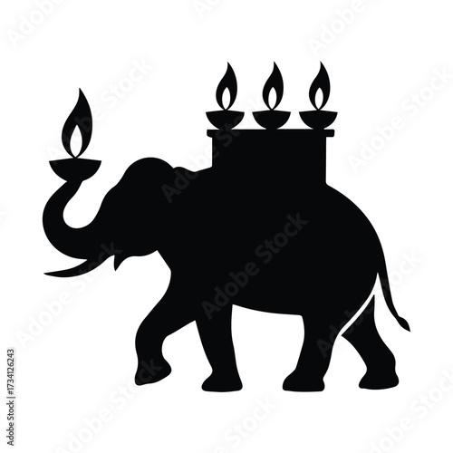 Silhouette of an elephant carrying decorative oil lamps in a ceremonial procession silhouette