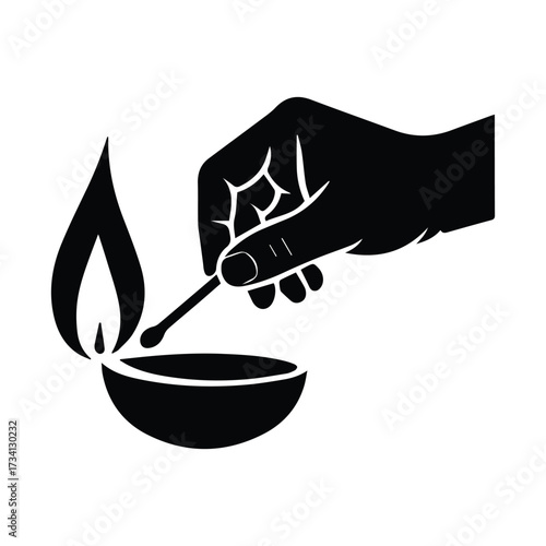 Hand lighting oil lamp with matchstick silhouette for fire and light concept silhouette