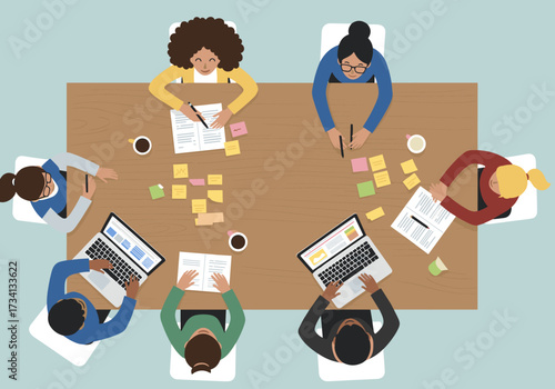 Collaborative brainstorming session office digital content modern environment overhead view teamwork dynamics