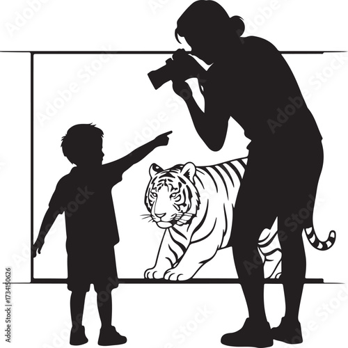 Silhouette of a parent and child viewing a tiger exhibit