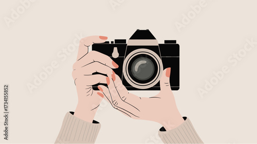 Hands Holding a Vintage Camera on Beige Background
