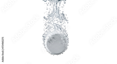 Isolated effervescent tablet dissolving in liquid with bubbles in transparent solution