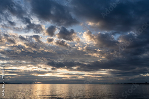 sunset over Lake Constance / Bodensee in Bregenz Vorarlberg Austria with clouds and intense colours and blue sky