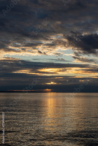sunset over Lake Constance / Bodensee in Bregenz Vorarlberg Austria with clouds and intense colours and blue sky