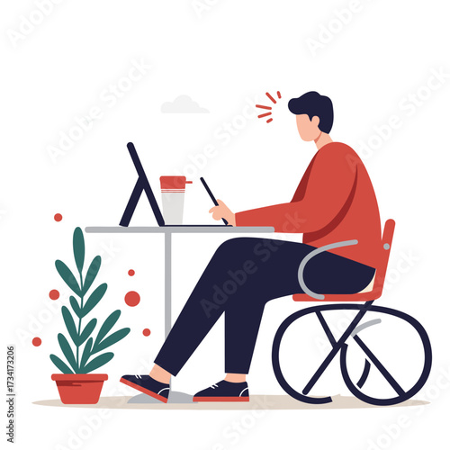 Man in wheelchair working on tablet at desk