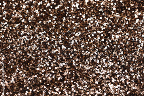 Obraz na plátně Close-up of shimmering gold brown spangle fabric with sequins creating a sparkling texture, perfect for fashion, textiles, and luxury design backgrounds