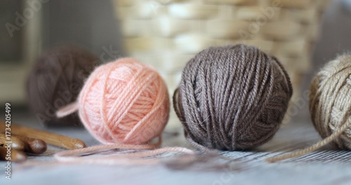 Clews balls of yarn wool and crochet hooks and a basket photo 