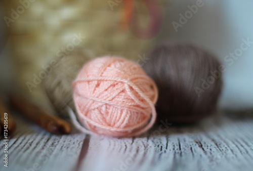 Clews balls of yarn wool and crochet hooks and a basket photo 