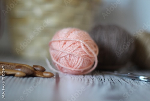Clews balls of yarn wool and crochet hooks and a basket photo 