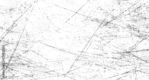 white surface covered in numerous thin, dark grey scratches and speckles creating a distressed texture.