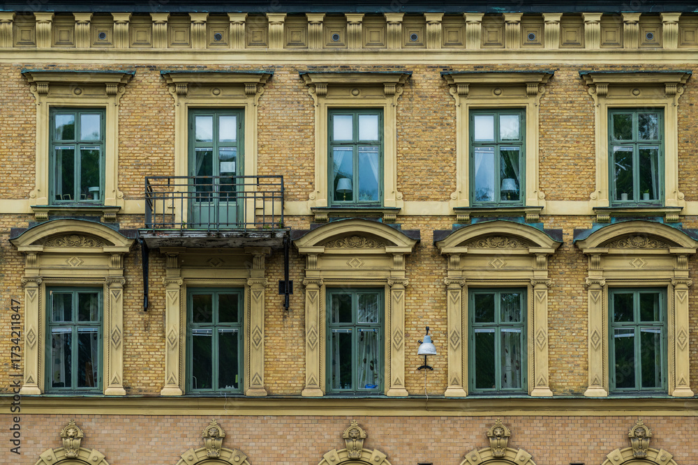 Fototapeta premium Classic window facade with ornate frames.