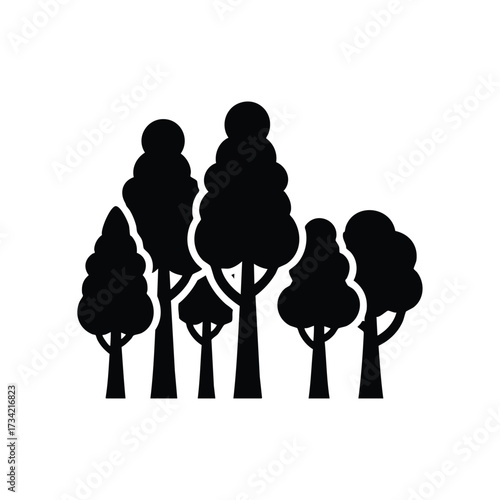 Silhouette of a variety of trees with different shapes and sizes creating a natural forest scene