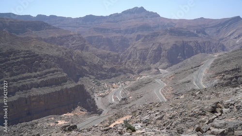 The mountains rise in the background, when a stormy area is cut into winding roads. The scene reflects the natural beauty of this distant landscape in sunlight.