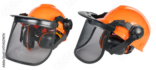 Closeup of protective chainsaw helmets with mesh visor and ear defenders isolated on white background. Front and side view of orange safety gear for head protection with net face shield for eye guard.