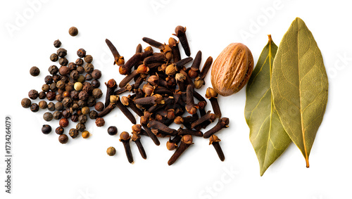 Fototapeta Naklejka Na Ścianę i Meble -  Aromatic spices whole black peppercorns cloves nutmeg and bay leaves for culinary use