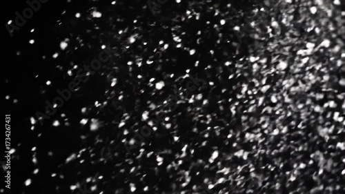 Closeup of Water Droplets Falling in Darkness with Dynamic Motion