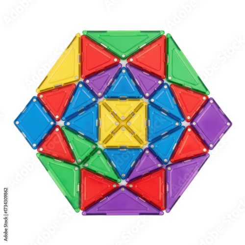 Colorful translucent magnetic building tiles arranged in a symmetrical geometric mosaic pattern.