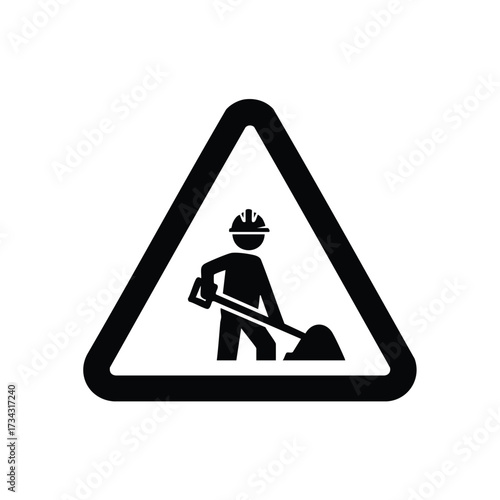 Worker with a shovel wearing a safety helmet within a triangular warning sign symbolizing construction or roadwork caution