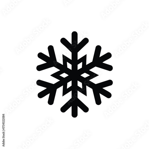 Symmetrical snowflake with intricate branching patterns and six-fold radial symmetry on a plain