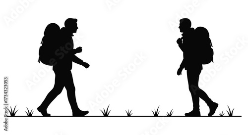 Two hikers with backpacks walking towards each other a striking silhouette