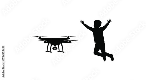 A joyful child and a flying drone captured in a striking silhouette