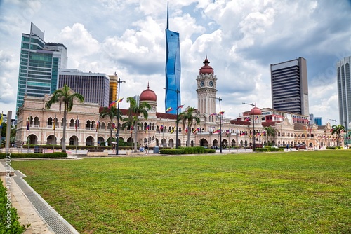 Photography Sultan Abdul Samad Building in Kuala Lumpur, Malaysia, with Moorish architecture, copper domes and city skyline in background