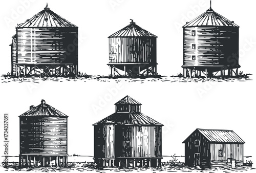 A collection of vintage silos showcasing traditional agricultural architecture in black and white..