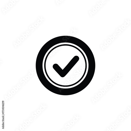 Close-up of a round button with a check mark symbol indicating approval or confirmation on a plain