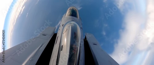 Wallpaper Mural Stunning view from the cockpit of a fighter jet soaring through the blue skies above clouds Torontodigital.ca