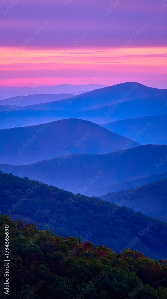 Fototapeta premium Misty mountain ranges at dawn