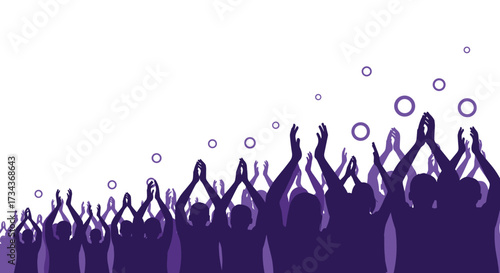 A large crowd of people standing together applauding with excitement and celebration.