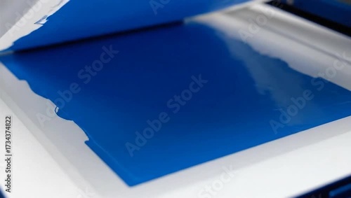 Pristine white milk rests in a gleaming stainless steel pot from an overhead perspective, ready for cooking or baking preparations.