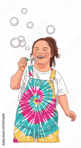 Happy girl blowing bubbles while wearing colorful tie-dye overalls, image diversity concept  