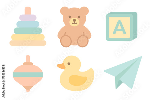 Assortment of classic baby and toddler toys including a teddy bear, stacking rings, alphabet block, and rubber duck
