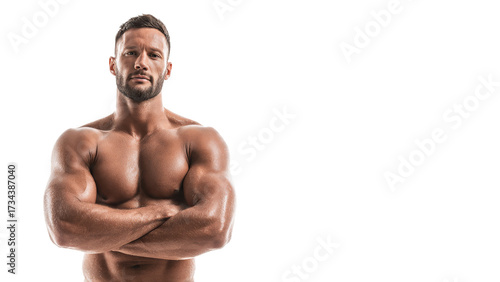 Strong muscular athlete and confident man standing for fitness. powerful bodybuilder with crossed arm showing strength