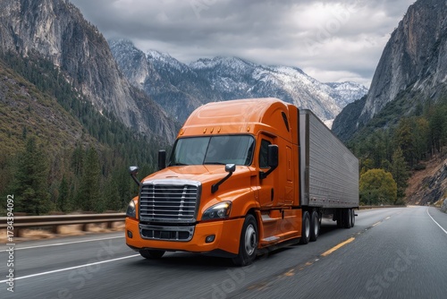 Orange Semi- Truck Driving Through Mountain Pass semi-truck