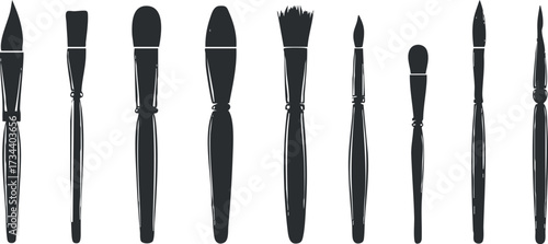 A collection of various art brushes arranged in a row for creative projects and painting..