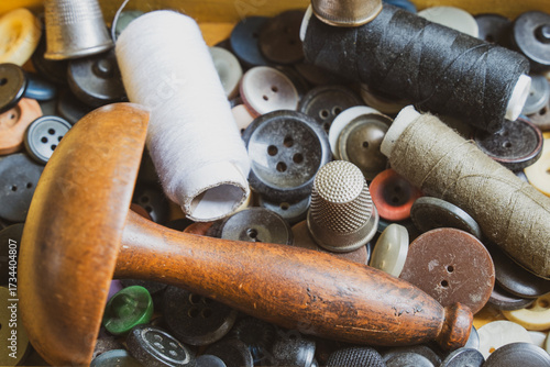 Collection of vintage sewing tools in an old sewing box