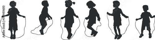 Silhouette of children joyfully jumping rope showcasing energy and playful outdoor activity..