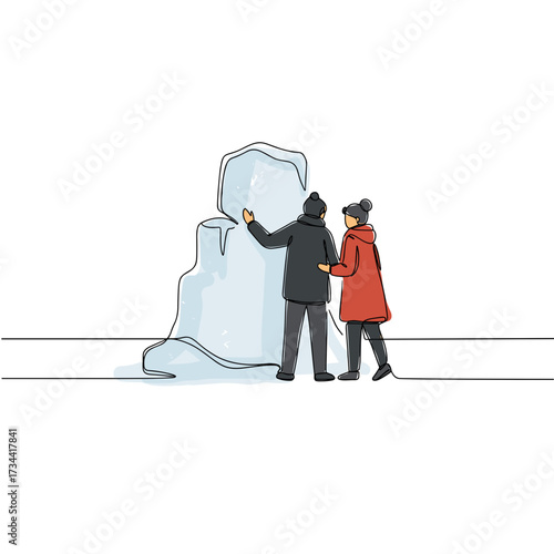 Couple admiring ice sculpture in winter while dressed warmly  