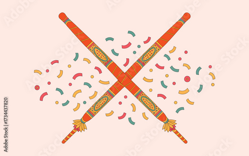 Two crossed decorated dandiya sticks with confetti