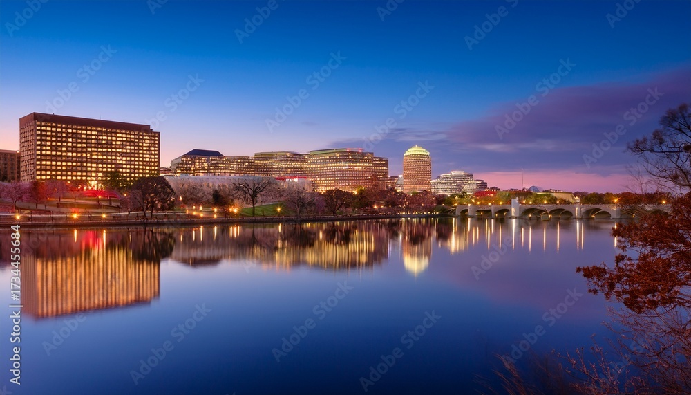 Fototapeta premium stunning arlington va skyline at dusk with vibrant city lights and reflection on the potomac river